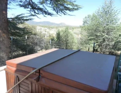 shared hot tub with mountain view, available to guests in any of the three rentable units under the same roof