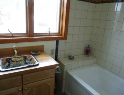 full bathroom contains talavara sink and Mexican tiles