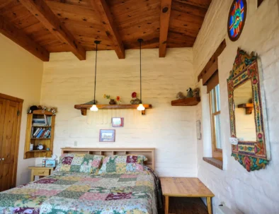 stained glass window, king bed, Mexican mirror