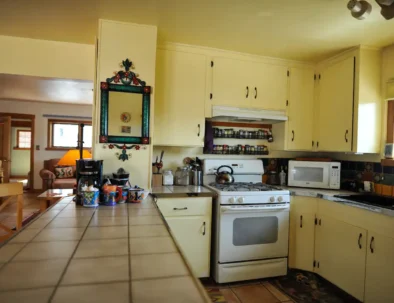 kitchen counter and Mexican mirror, gas stove